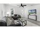 Living room with gray sofas, coffee table, and a TV at 1441 Dann St, Orlando, FL 32804
