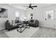 Spacious living room with gray sofas and a large window at 1441 Dann St, Orlando, FL 32804
