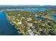 Expansive aerial view of waterfront homes and lush landscape at 2224 Hoffner Ave, Belle Isle, FL 32809