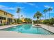 Community swimming pool with surrounding patio and palm trees at 2496 Grand Central Pkwy # 7, Orlando, FL 32839