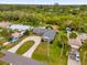 Aerial view of a single Gathering home, large backyard and a neighborhood at 2533 Edgewater Ave, New Smyrna Beach, FL 32168