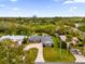 Aerial view of a single-Gathering home with a large yard and circular driveway at 2533 Edgewater Ave, New Smyrna Beach, FL 32168
