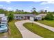Aerial view of a single Gathering home with a large driveway at 2533 Edgewater Ave, New Smyrna Beach, FL 32168