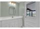 Modern bathroom with updated vanity and large mirror at 2533 Edgewater Ave, New Smyrna Beach, FL 32168