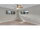 Bright bedroom featuring ceiling fan and large windows at 2533 Edgewater Ave, New Smyrna Beach, FL 32168