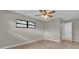 Bedroom with ceiling fan and access to bathroom at 2533 Edgewater Ave, New Smyrna Beach, FL 32168