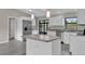 Modern kitchen with granite countertops and white cabinets at 2533 Edgewater Ave, New Smyrna Beach, FL 32168