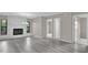 Spacious living area with gray flooring and access to bedrooms at 2533 Edgewater Ave, New Smyrna Beach, FL 32168
