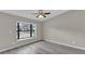 Living room with large window and wood-look flooring at 2533 Edgewater Ave, New Smyrna Beach, FL 32168