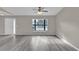 Living room featuring large window and vinyl flooring at 2533 Edgewater Ave, New Smyrna Beach, FL 32168