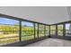 Bright sunroom with view of backyard and tiled flooring at 2533 Edgewater Ave, New Smyrna Beach, FL 32168