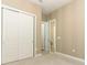 Spacious bedroom with neutral wall colors and carpet flooring at 3449 Michigan St, Lake Mary, FL 32746