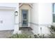 Front entry with blue door and stone pathway at 3449 Michigan St, Lake Mary, FL 32746