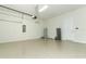 Two-car garage with epoxy flooring and storage at 3449 Michigan St, Lake Mary, FL 32746