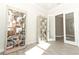 Sunlit home office with French doors and built-in shelving at 3449 Michigan St, Lake Mary, FL 32746