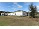 House exterior with covered patio and manicured landscaping at 3449 Michigan St, Lake Mary, FL 32746