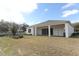 Single story house with covered patio and landscaped yard at 3449 Michigan St, Lake Mary, FL 32746