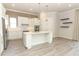 Modern kitchen with white cabinets and island at 3449 Michigan St, Lake Mary, FL 32746