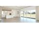 Open kitchen with island and view of backyard at 3449 Michigan St, Lake Mary, FL 32746