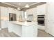 Modern kitchen with large island and stainless steel appliances at 3449 Michigan St, Lake Mary, FL 32746