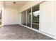 Covered patio with sliding glass doors leading to backyard at 3449 Michigan St, Lake Mary, FL 32746