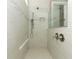 Large walk-in shower with neutral tile and dual shower heads at 3449 Michigan St, Lake Mary, FL 32746
