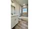 Modern bathroom with a bathtub, shower, and white vanity at 559 Marion Oaks Blvd, Ocala, FL 34473