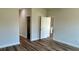 Bright bedroom with hardwood floors and access to a closet and bathroom at 559 Marion Oaks Blvd, Ocala, FL 34473