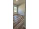 Spacious bedroom with wood-look floors and a window at 559 Marion Oaks Blvd, Ocala, FL 34473