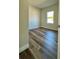 Bright bedroom with wood-look floors and a window at 559 Marion Oaks Blvd, Ocala, FL 34473