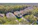 Aerial view of a two-story house with a yard at 8458 Secret Key Cove, Kissimmee, FL 34747