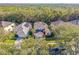 Aerial view of a two-story house with a yard at 8458 Secret Key Cove, Kissimmee, FL 34747