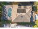 Aerial view of house with pool and solar panels at 8458 Secret Key Cove, Kissimmee, FL 34747