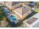 Aerial view of house with pool and solar panels at 8458 Secret Key Cove, Kissimmee, FL 34747