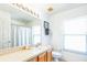 Bathroom with tub, single sink vanity at 8458 Secret Key Cove, Kissimmee, FL 34747