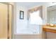 Bathroom with corner tub and shower at 8458 Secret Key Cove, Kissimmee, FL 34747