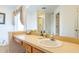 Bathroom with vanity, sink, and large mirror at 8458 Secret Key Cove, Kissimmee, FL 34747