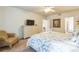 King-size bed, dresser, and sitting area at 8458 Secret Key Cove, Kissimmee, FL 34747