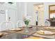 Close-up view of a beautifully set dining table with elegant place settings at 8458 Secret Key Cove, Kissimmee, FL 34747