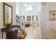Bright entryway with staircase, mirror, and view into living room at 8458 Secret Key Cove, Kissimmee, FL 34747