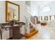 Bright entryway with staircase, mirror, and view into living room at 8458 Secret Key Cove, Kissimmee, FL 34747
