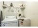 Convenient laundry room with washer and dryer at 8458 Secret Key Cove, Kissimmee, FL 34747