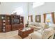 Comfortable living room featuring a built-in entertainment center and seating area at 8458 Secret Key Cove, Kissimmee, FL 34747