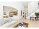 Spacious living room with high ceilings, hardwood floors, and ample natural light at 8458 Secret Key Cove, Kissimmee, FL 34747