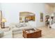 Open living room with high ceilings and views into the kitchen and dining area at 8458 Secret Key Cove, Kissimmee, FL 34747
