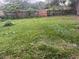Large backyard with wooden fence at 100 S Ortman Dr, Orlando, FL 32805