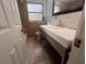 Updated bathroom with modern vanity and gold fixtures at 100 S Ortman Dr, Orlando, FL 32805