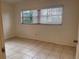 Bedroom with tile floors and window coverings at 100 S Ortman Dr, Orlando, FL 32805
