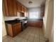 Kitchen with wood cabinets and stainless steel appliances at 100 S Ortman Dr, Orlando, FL 32805
