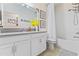 Clean bathroom with white cabinets and bathtub at 12420 Turtle Grass Dr, Orlando, FL 32824